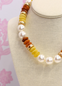 Brown and gold beaded necklace with pearl and rondelle accents