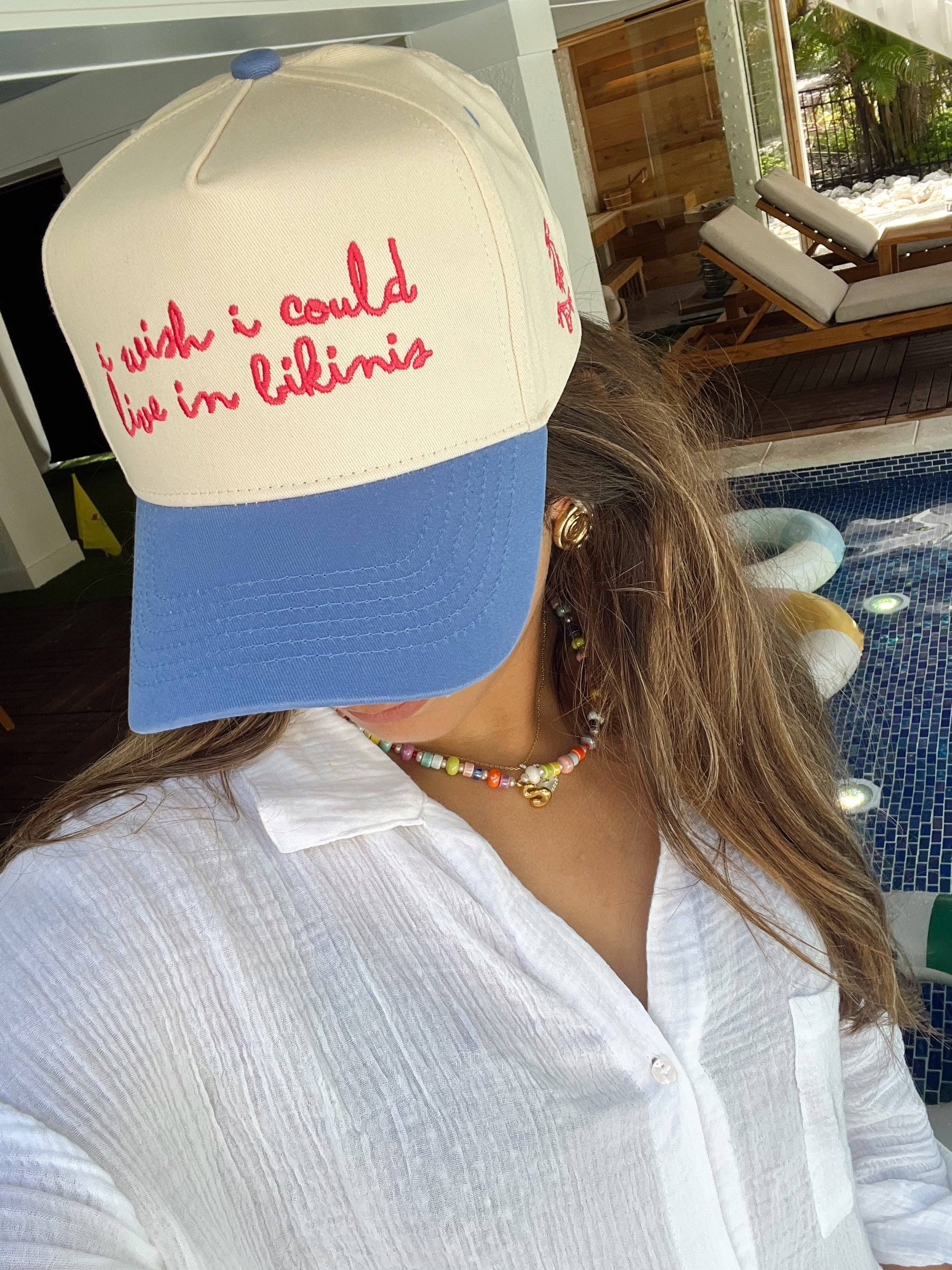 Front view of I Wish I Could Live in Bikinis blue vintage trucker hat