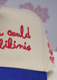 Blue graphic trucker hat styled with a casual summer outfit