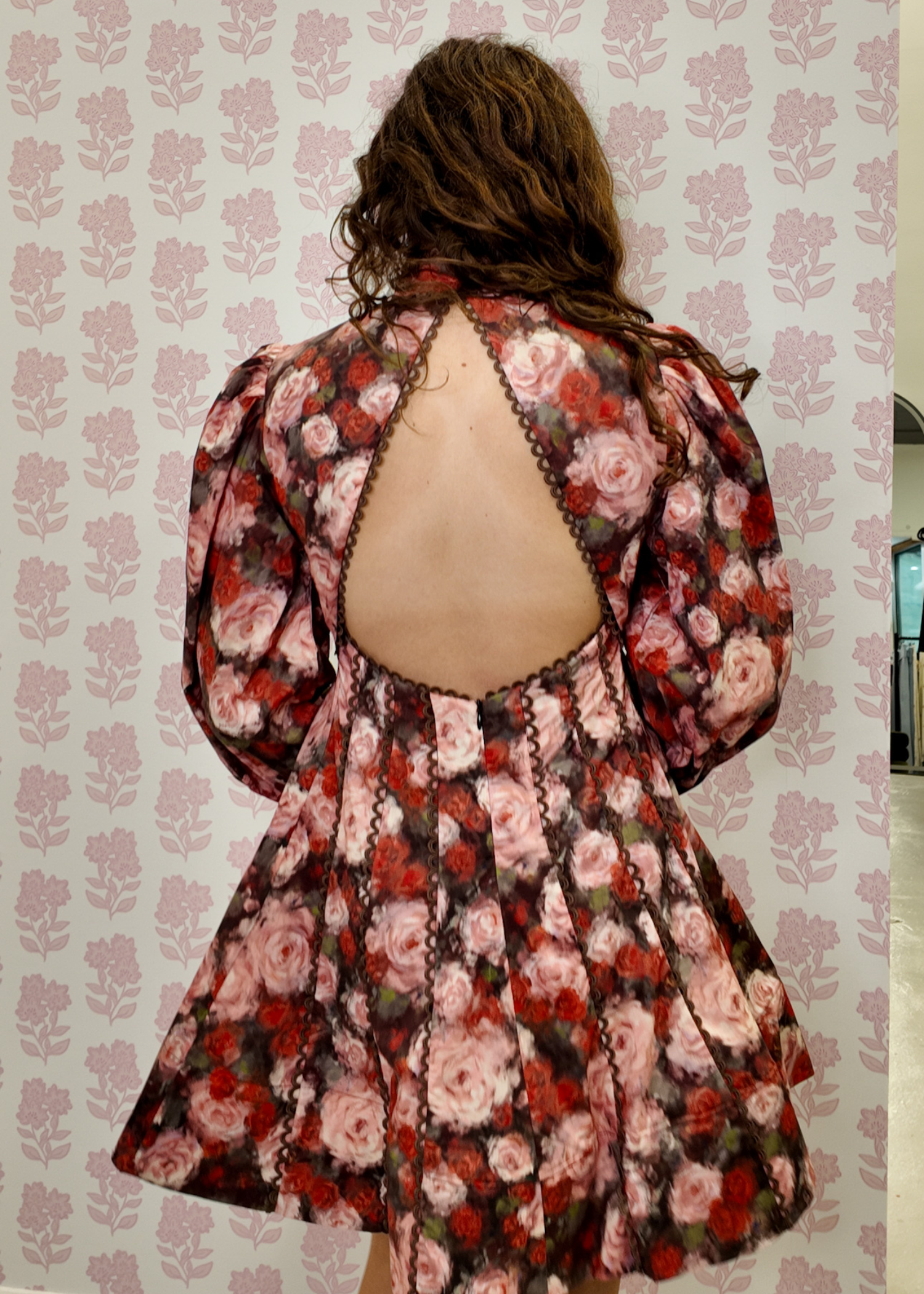Floral printed mini dress featuring subtle back cutout detail