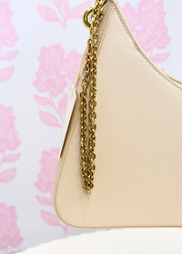 Cream shoulder bag with lightweight structure and spacious interior