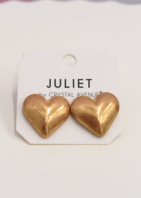 Gold puffy heart earrings featuring rounded heart design