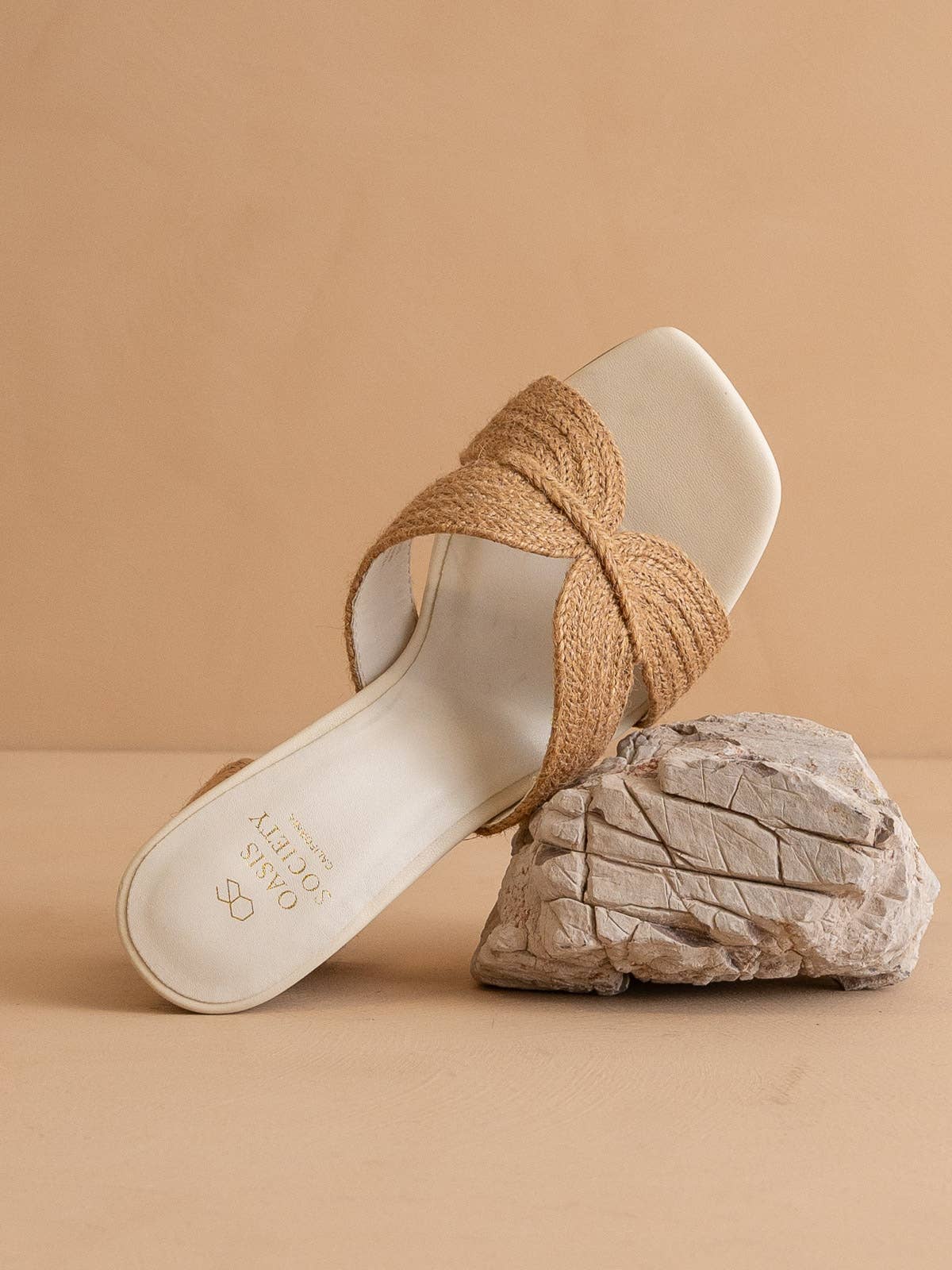 Toffee raffia heel leaning on rock