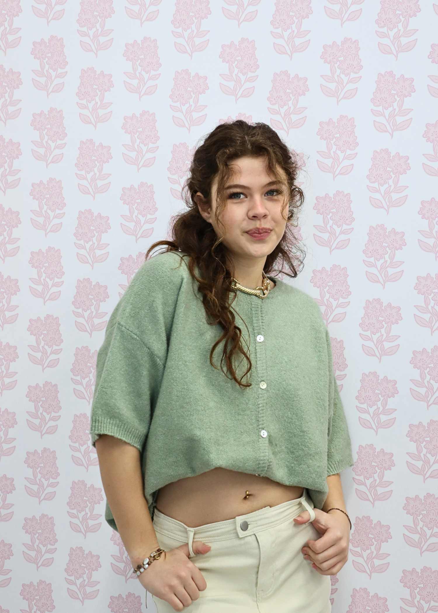 Side view of light green short sleeve knit cardigan