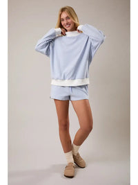 Back view of women’s blue cream striped cotton sweatshirt