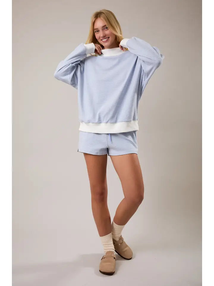 Back view of women’s blue cream striped cotton sweatshirt