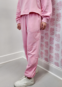 Pink jogger pants with heart patch detail and relaxed fit