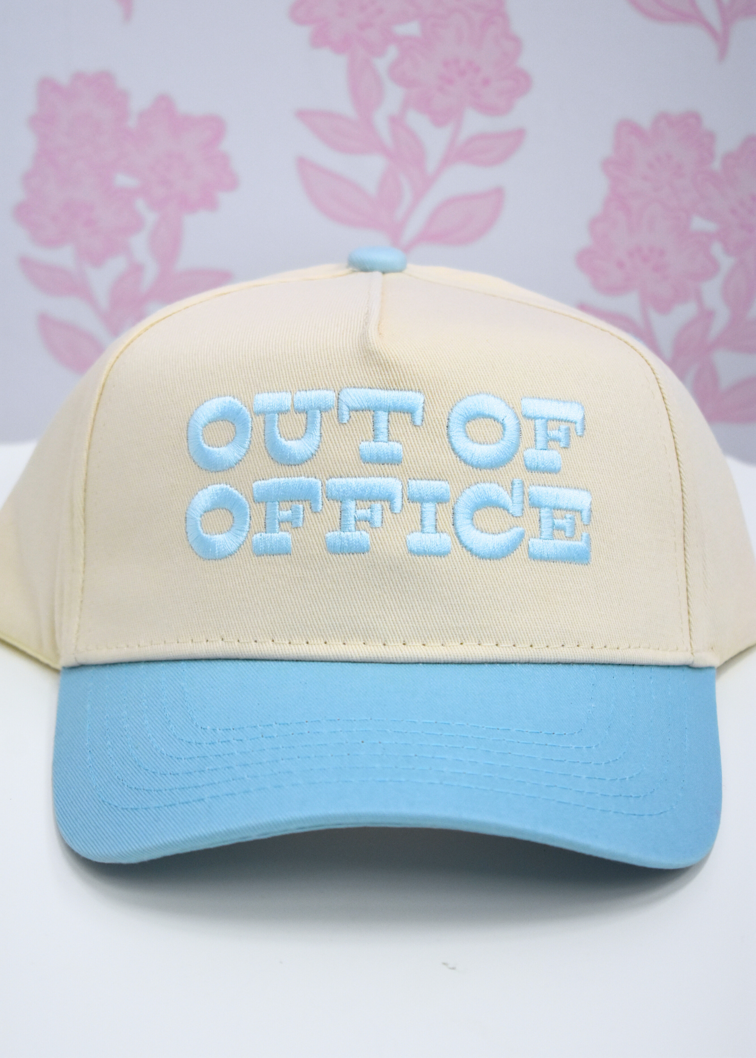 Out of Office trucker hat styled with casual vacation outfit