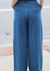 Close Up Back view of high rise wide leg dark wash denim pants