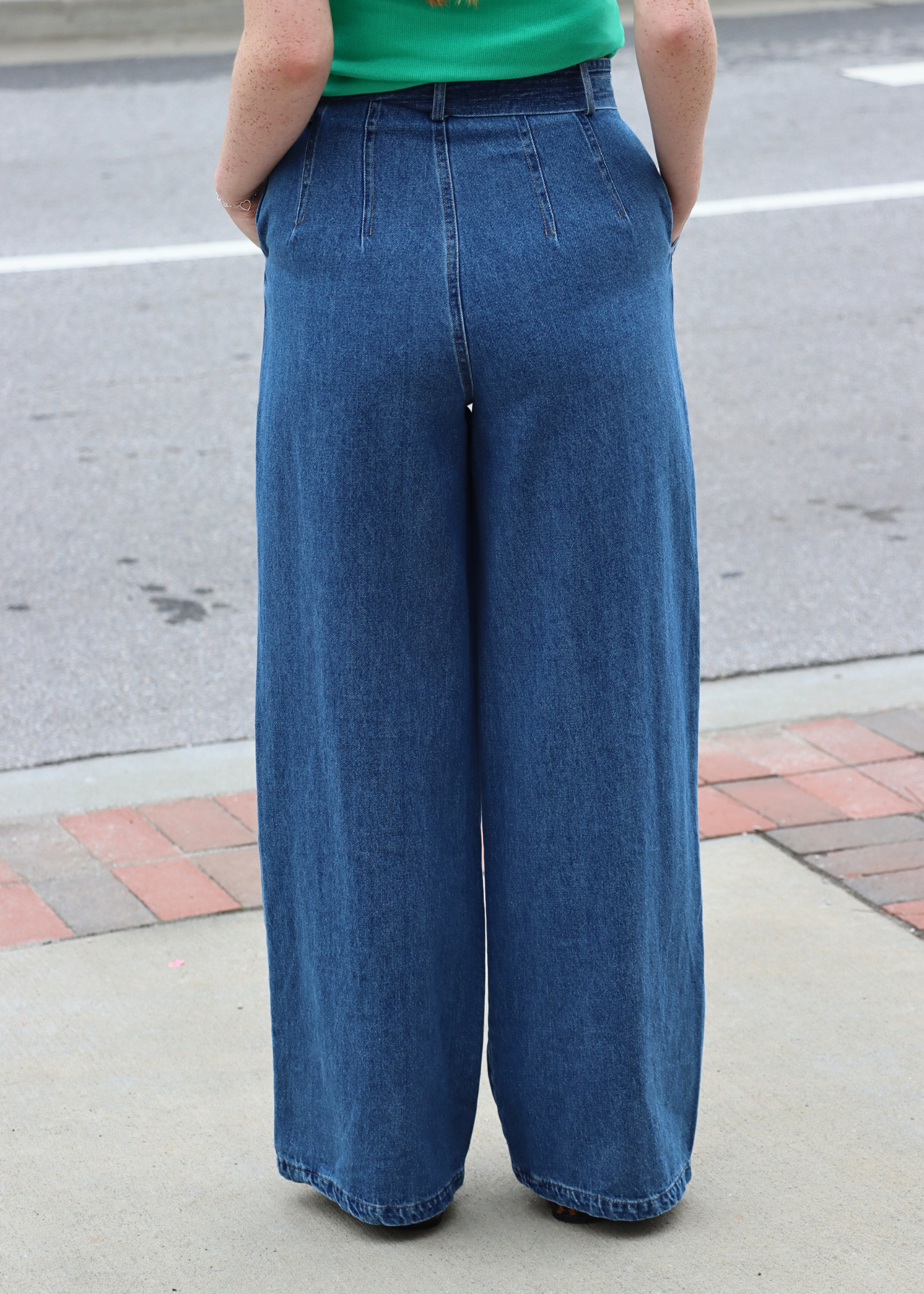 Back view of high rise wide leg dark wash denim pants