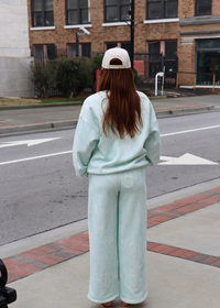 Back view of mint camo jogger sweatpants for women